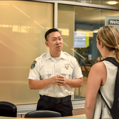 Security guard helping a student at school