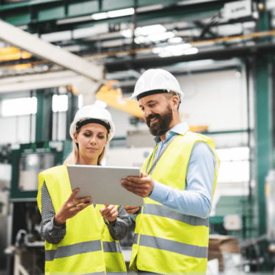 Two people working in a manufacturing facility